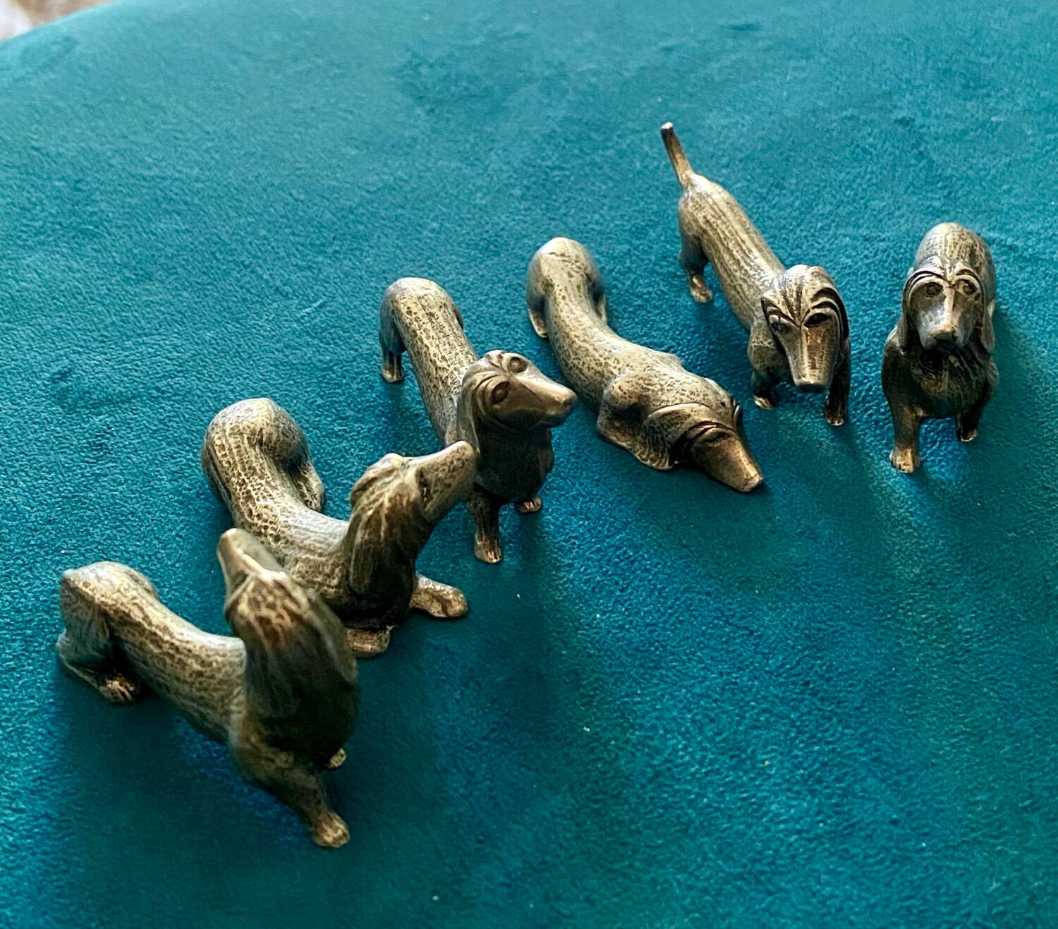 12 old dog-shaped Etains du Manoir knife holders