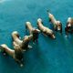 12 old dog-shaped Etains du Manoir knife holders