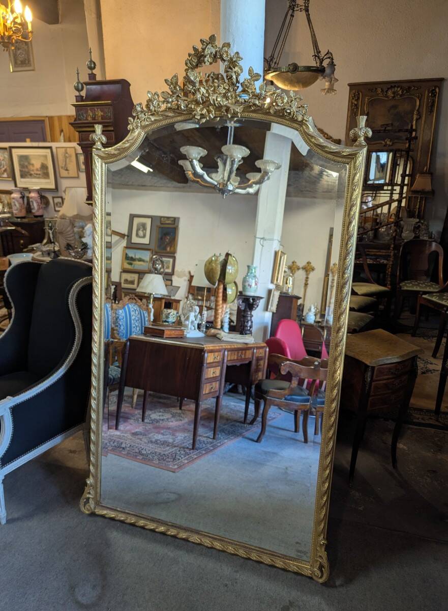 Very large Louis XVI style mirror in wood and gilded stucco with gold leaf