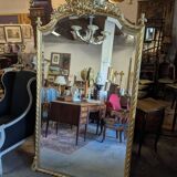 Very large Louis XVI style mirror in wood and gilded stucco with gold leaf