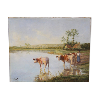 Oil on canvas depicting cows at the edge of the pond circa 1900