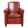 Armchair made of sheepskin leather in a red/brown color