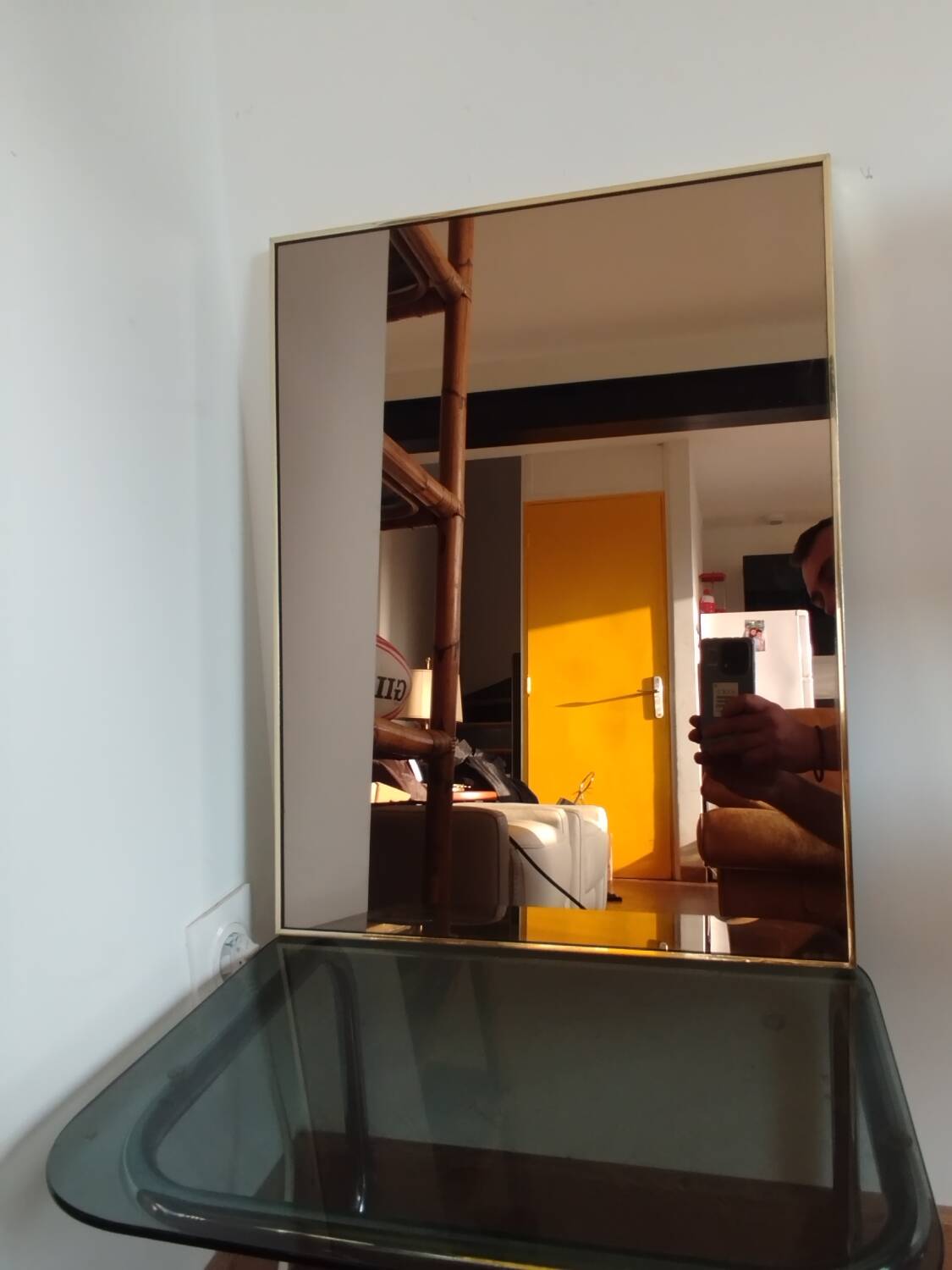 Vintage mirror in gilded brass and smoked glass. circa 1970