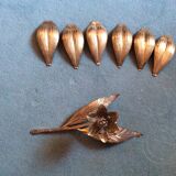 Flower of lilies wears golden 60s ashtrays