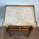 Pair of mahogany and brass side tables or bedside tables with Carrara marble tops.