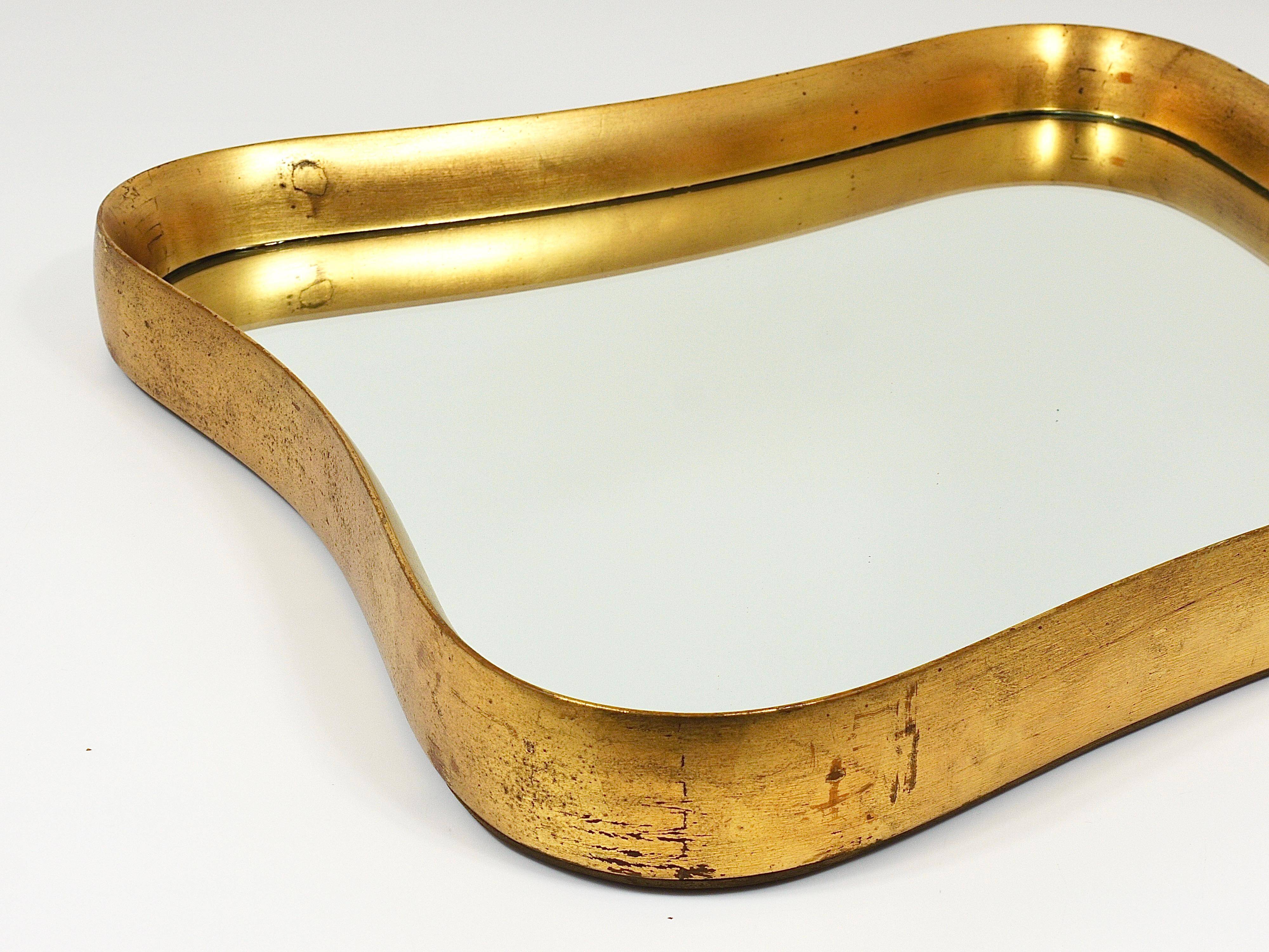 Golden wooden mirror in the style of Gio Ponti by Max Welz, Vienna, Austria, 1940s.