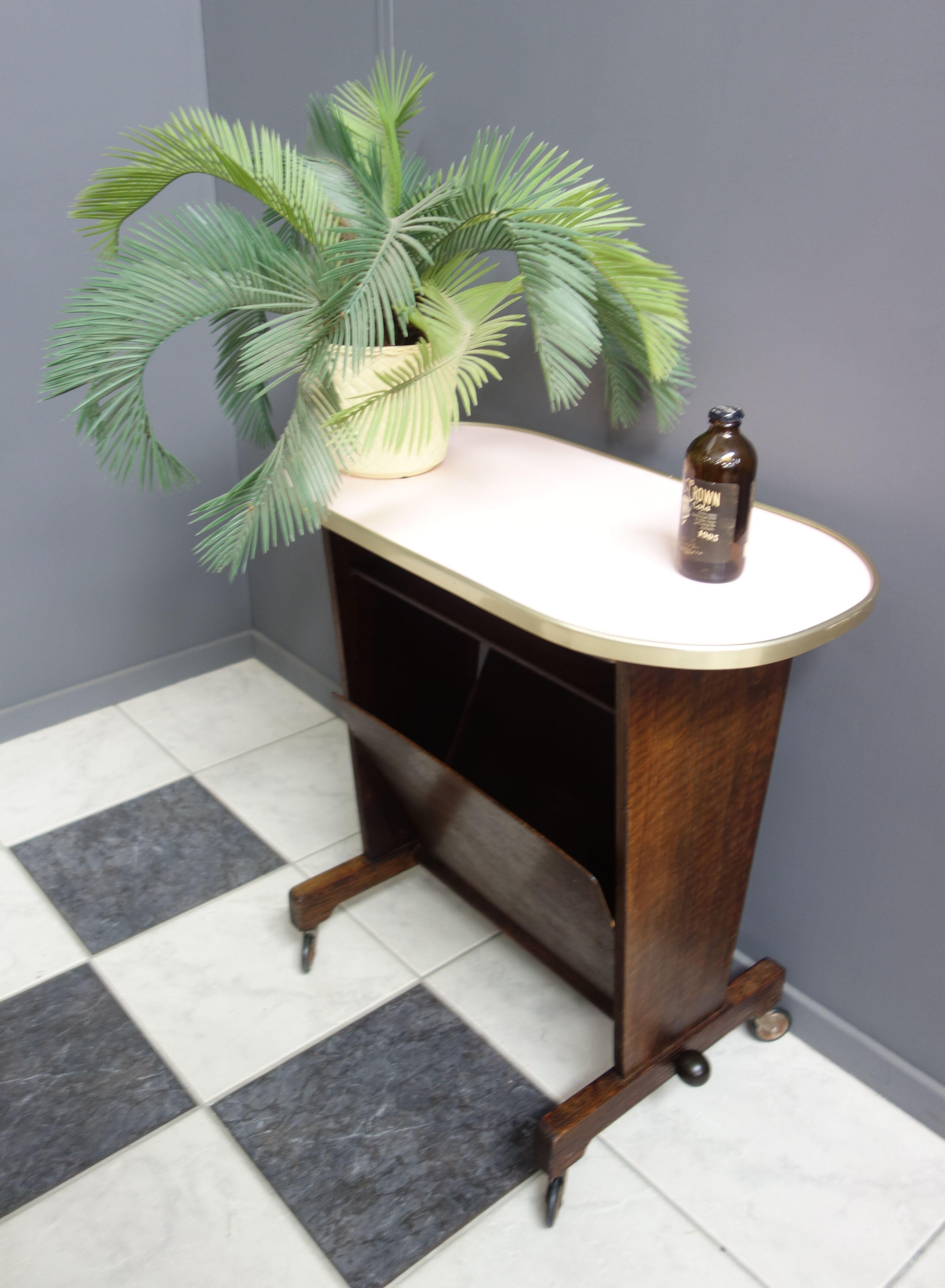 Pink formica magazine table 1950s