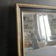 Miroir Napoléon III en bois noir et doré, XIXe siècle