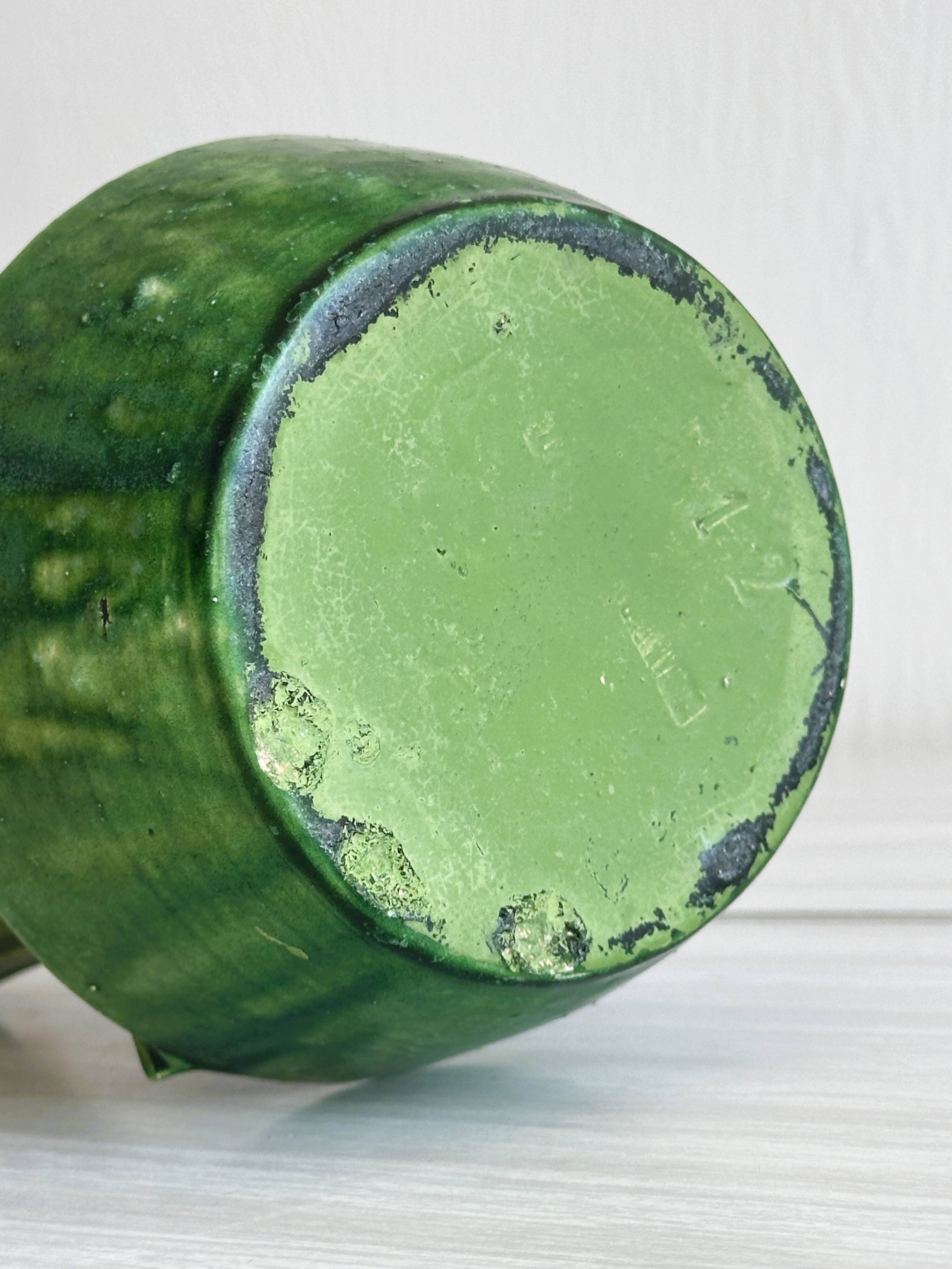 Pottery green ceramic vase with four handles.