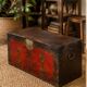 Antique Chinese Red Lacquered Trunk with Hand-Painted Floral Decorations