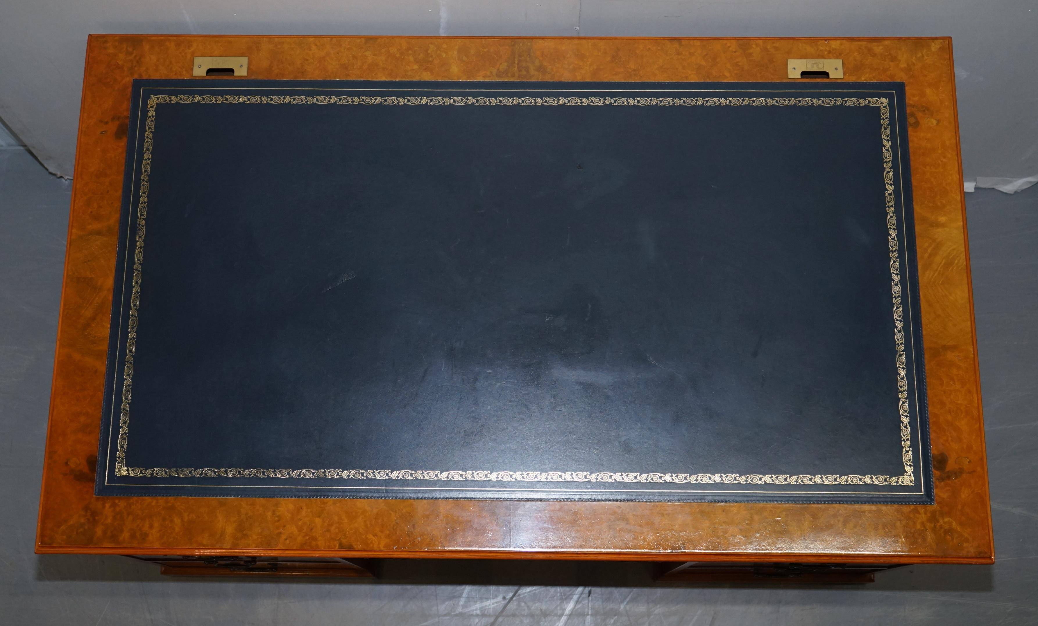 Partner desk in burr walnut designed to conceal computer equipment.