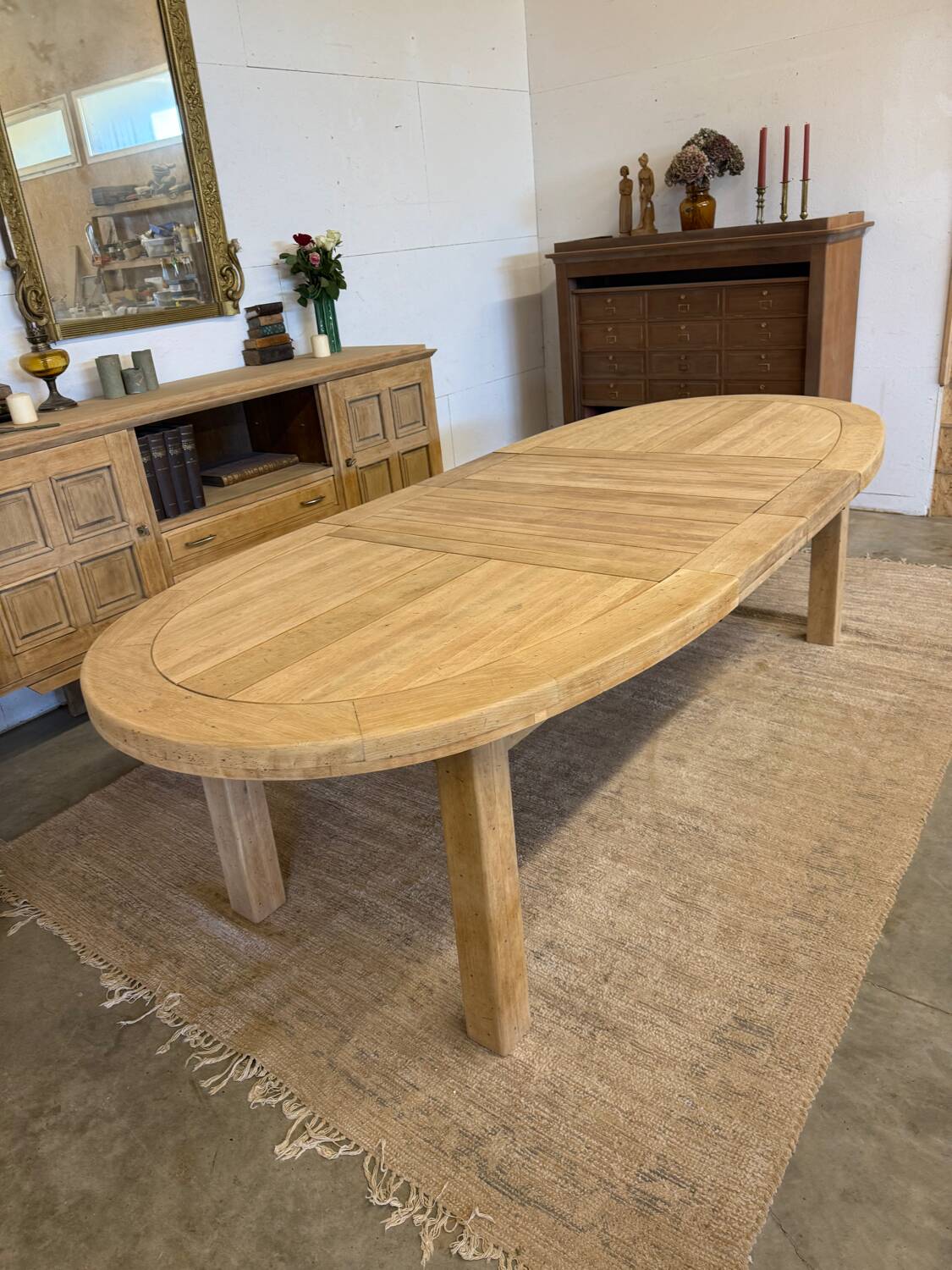 Oval farmhouse table in solid oak with extensions.