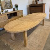 Oval farmhouse table in solid oak with extensions.
