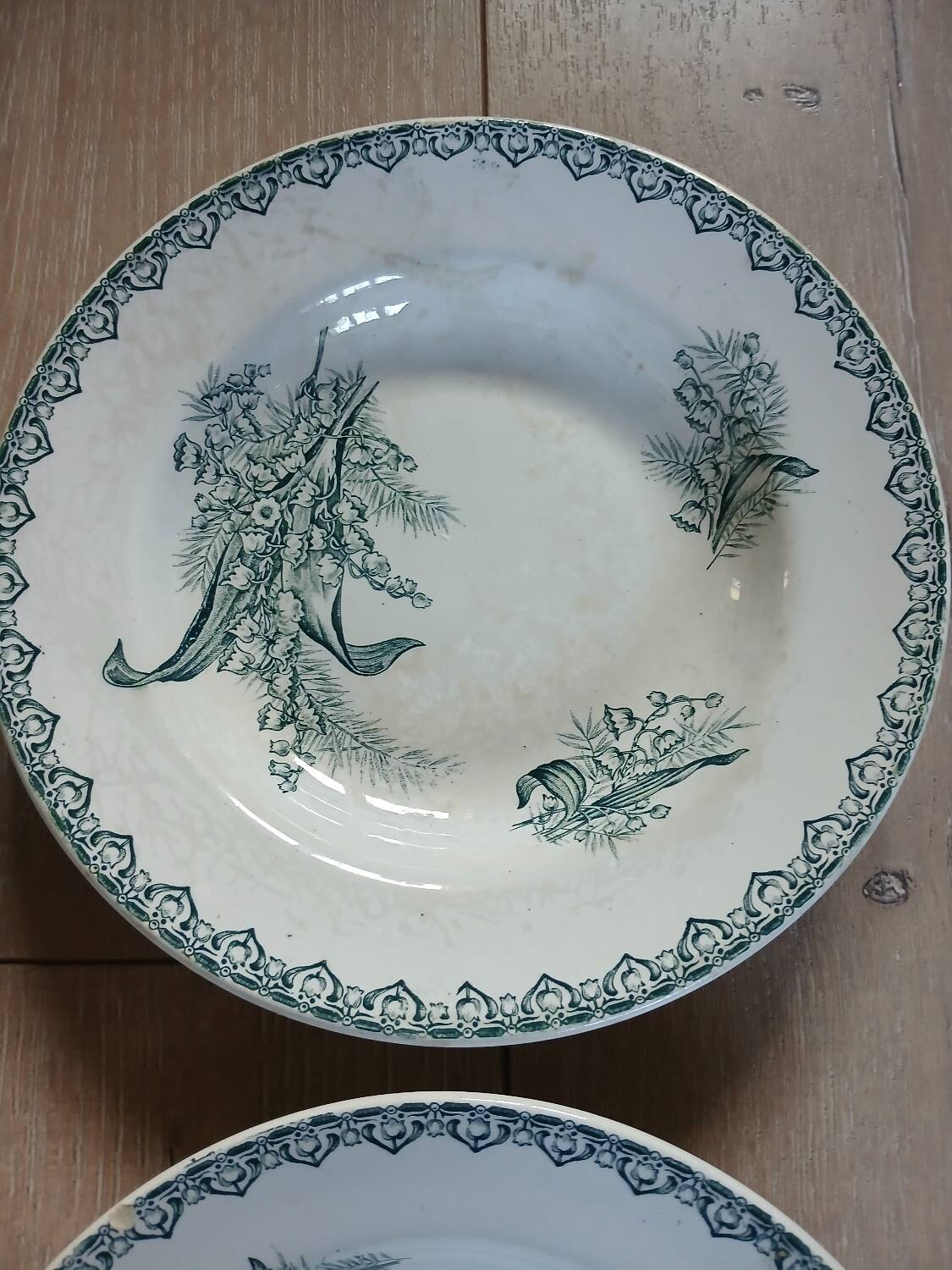 4 Terre de fer soup plates with lily of the valley motifs