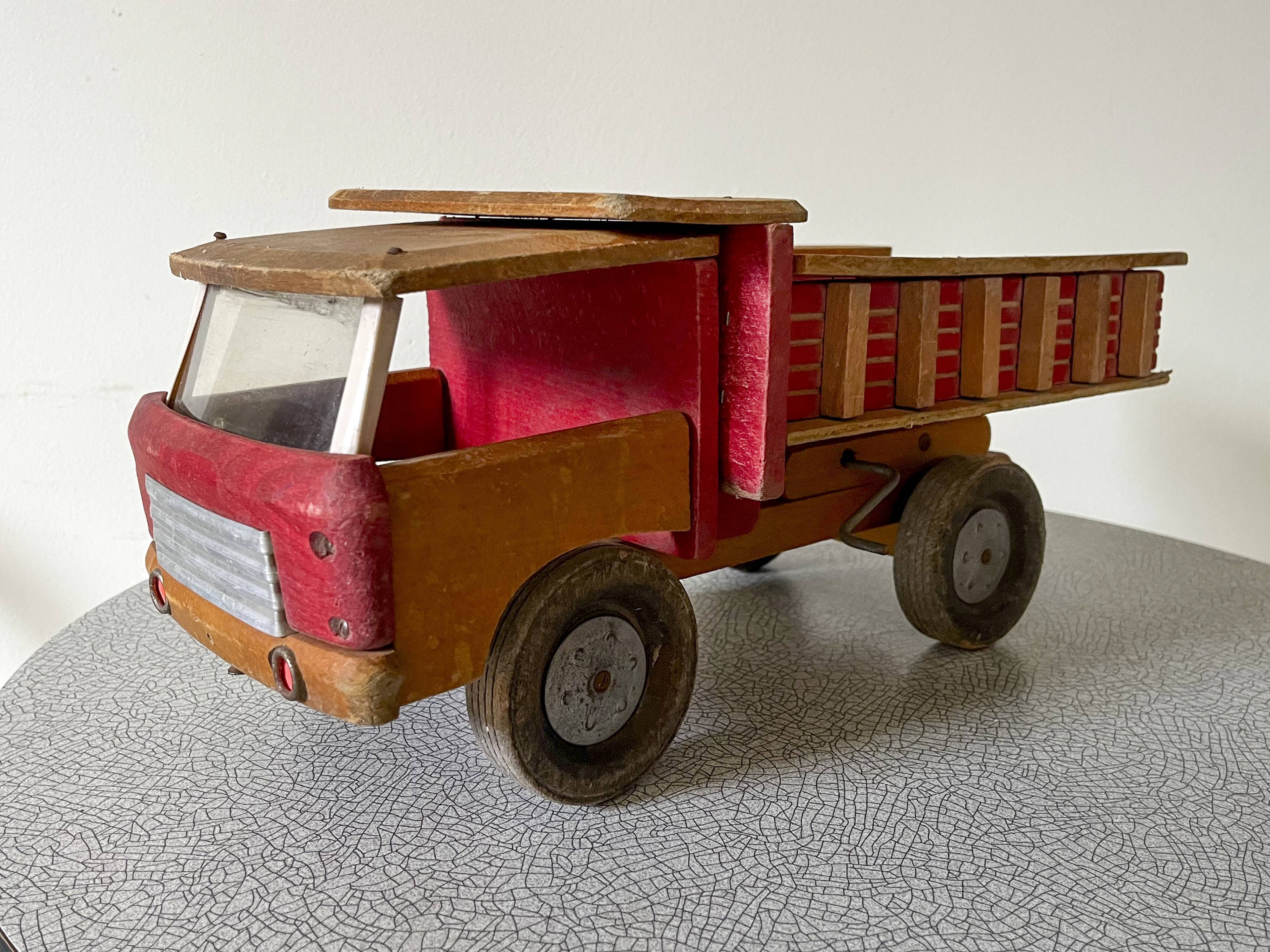 Wooden dump truck from the famous french brand dejou