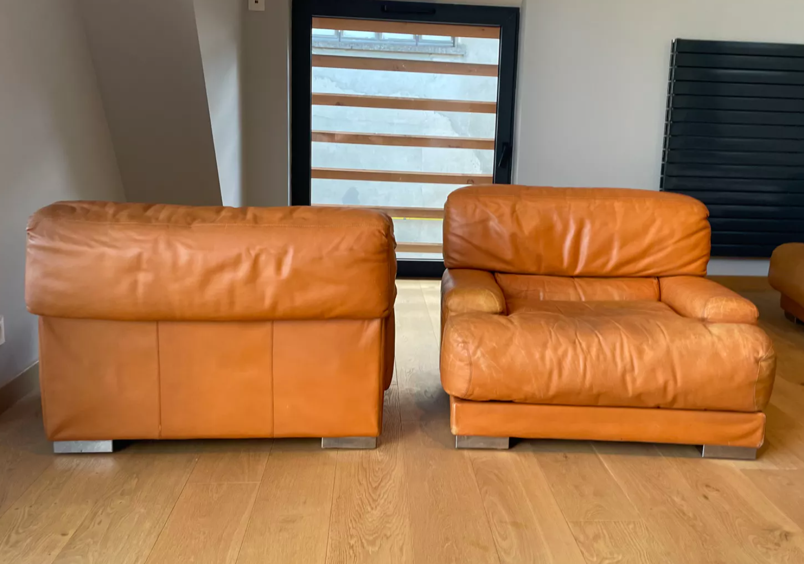 Pair of vintage armchairs Gérard Guermonprez tawny leather and stainless steel, France 1970