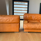 Pair of vintage armchairs Gérard Guermonprez tawny leather and stainless steel, France 1970