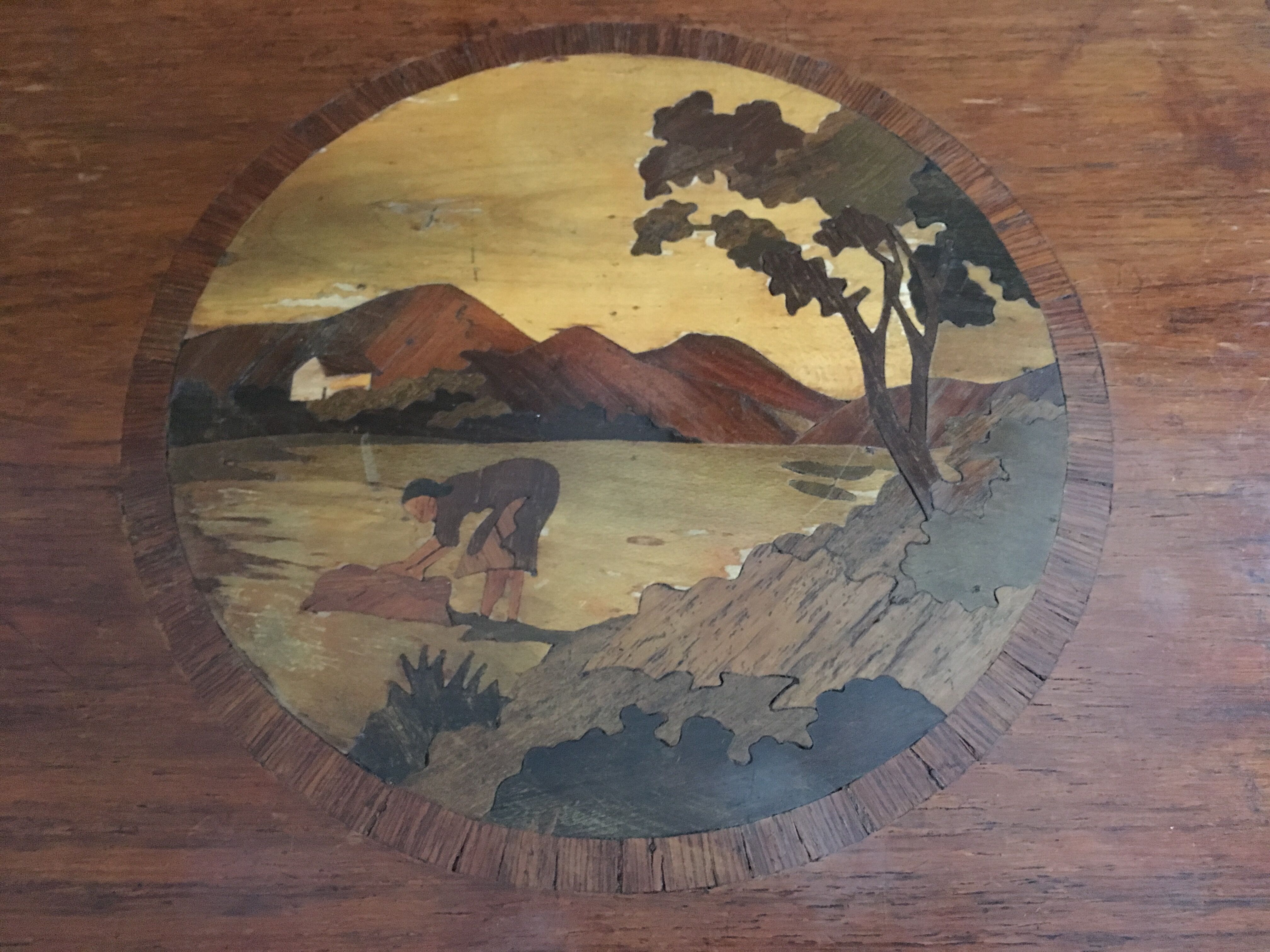 Old wooden serving tray with marquetry drawing