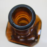 2 amber glass bottles with their old labels