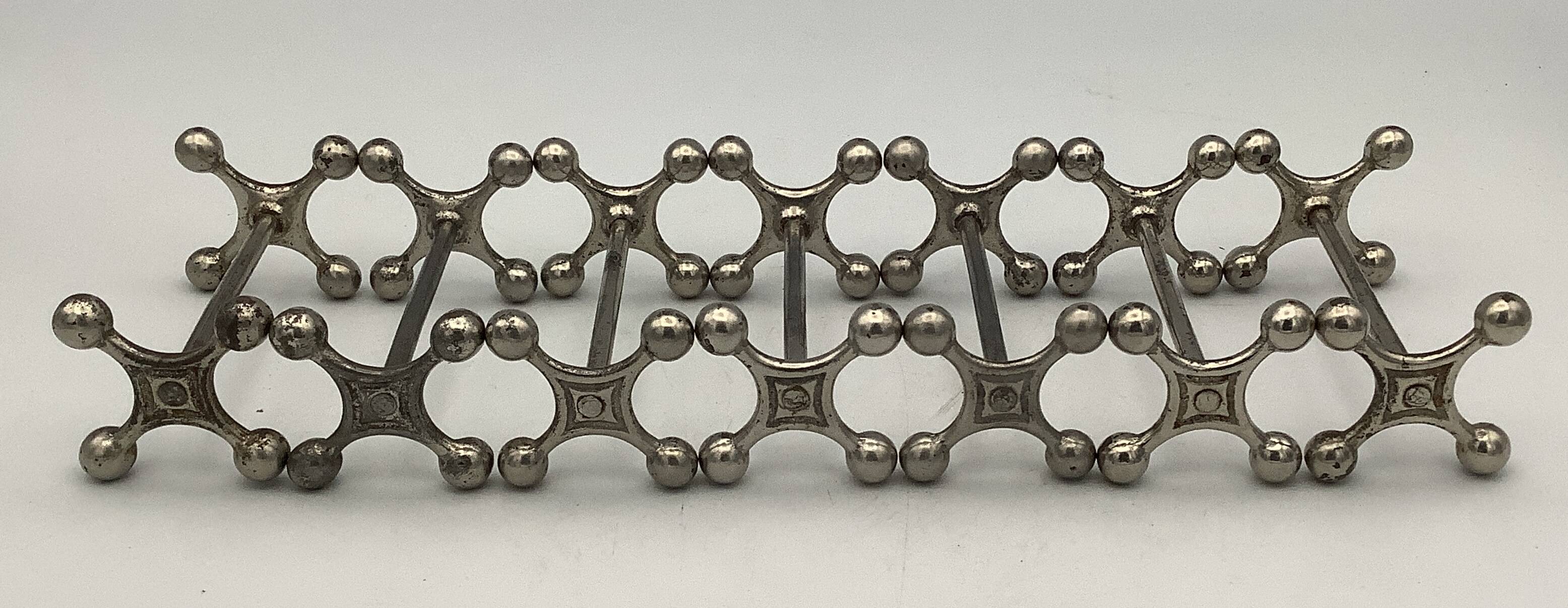 Set of 7 vintage knife rests in the shape of crosses in silver-plated metal.