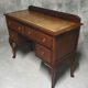 Old desk in cherry and green leather