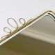 Wall mirror in brass wire with modernist loops from the mid-century, Italy, 1950s.