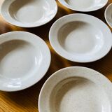 Set of 8 hollow plates in speckled ceramic