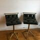 Pair of Chesterfield style brass and leather stools