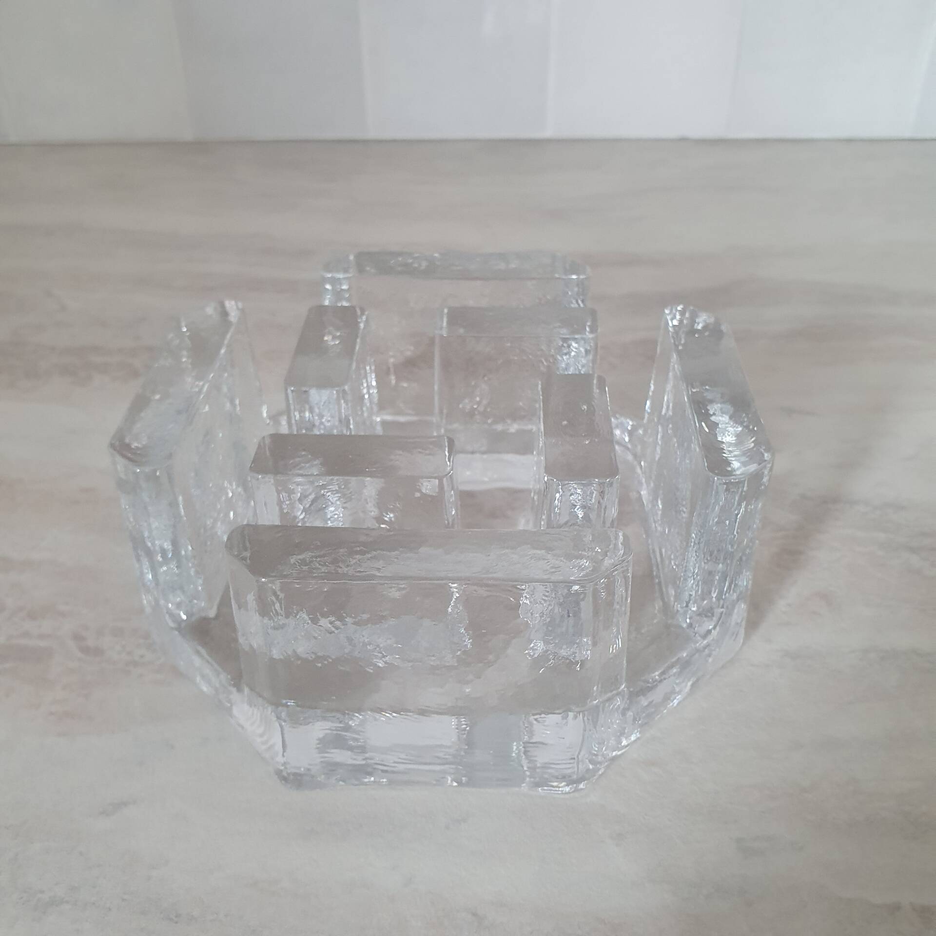 Candle holder or glass warmer with irregular ice effect.