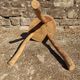 Rustic three-legged stool in minimalist wood in the style of Touret.