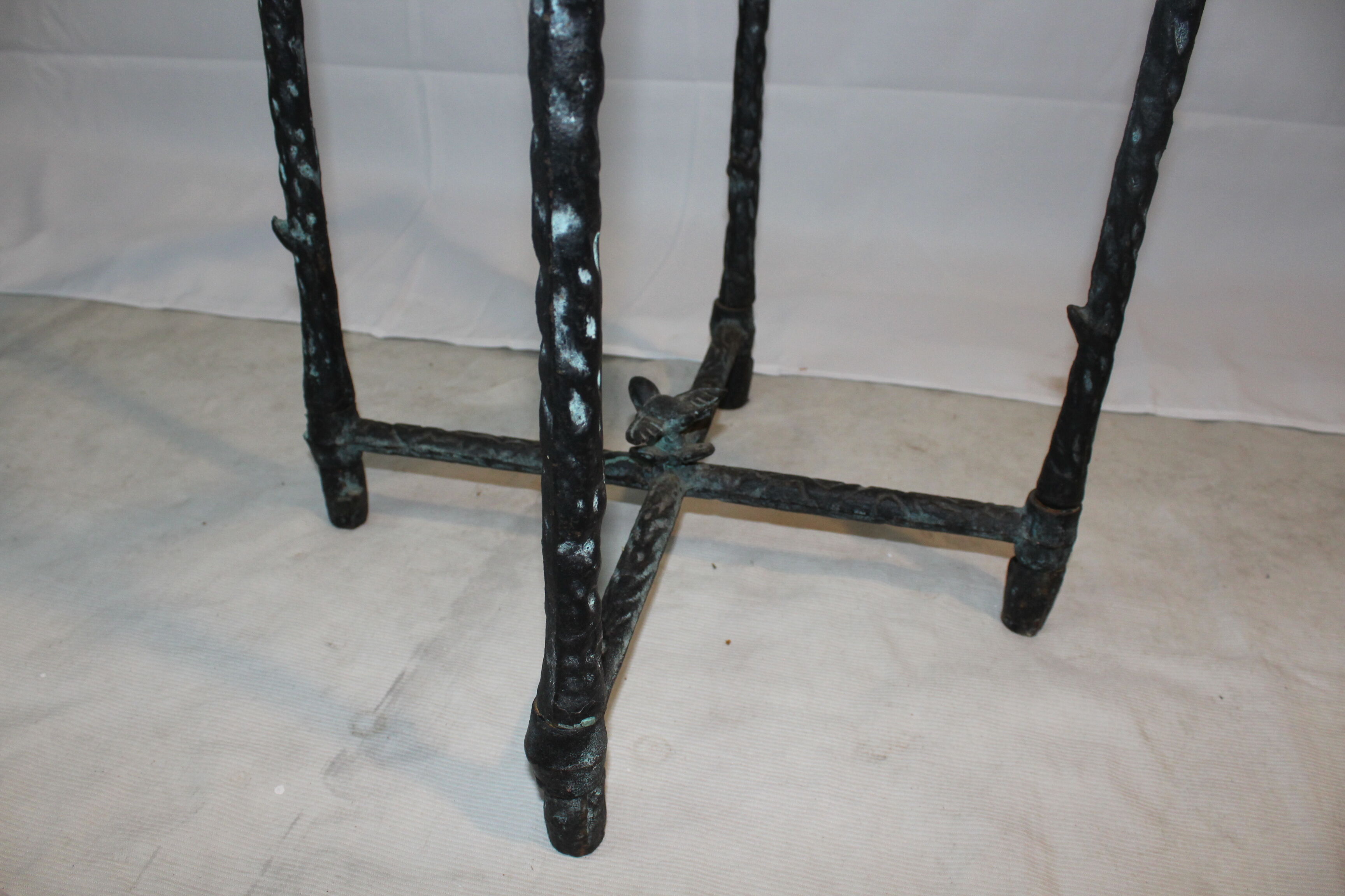 Giacometti style cast iron table, glass table