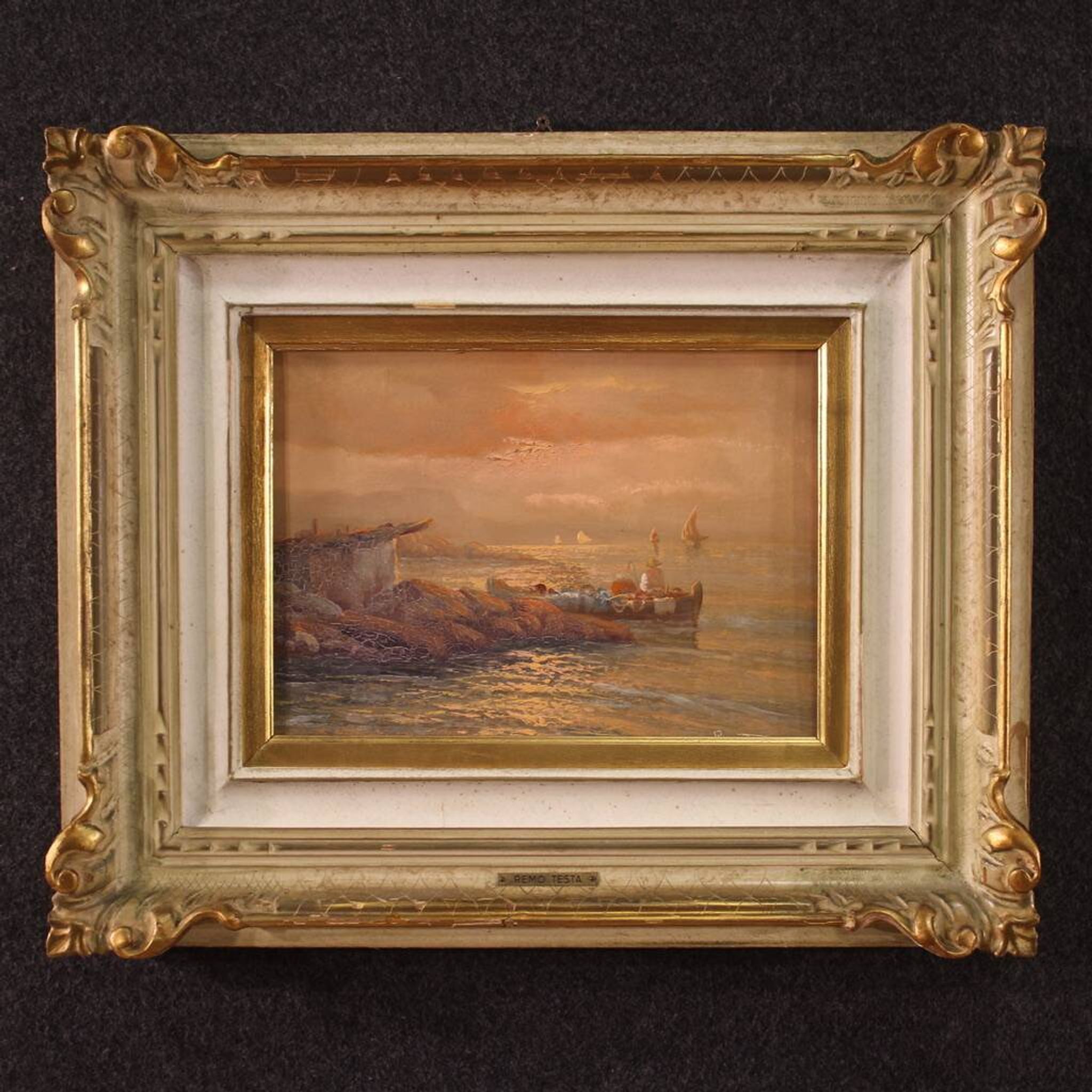 Seascape painting signed by Remo Testa, fishermen at sunset