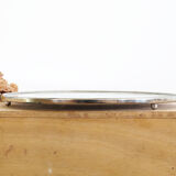 Round earthenware and metal trivets in the 30s or 40s