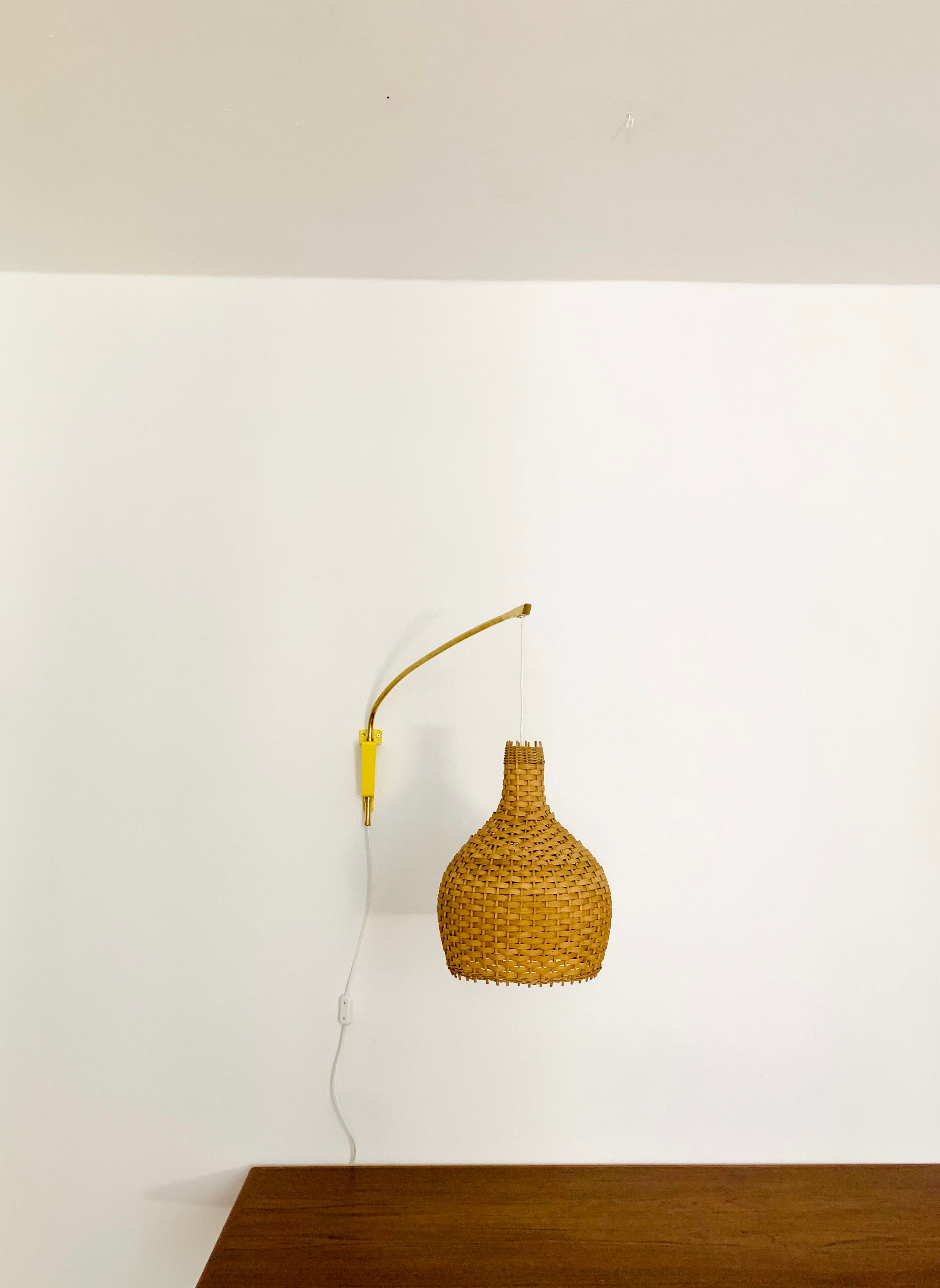 Adjustable Brass and Wicker Arc Sconce