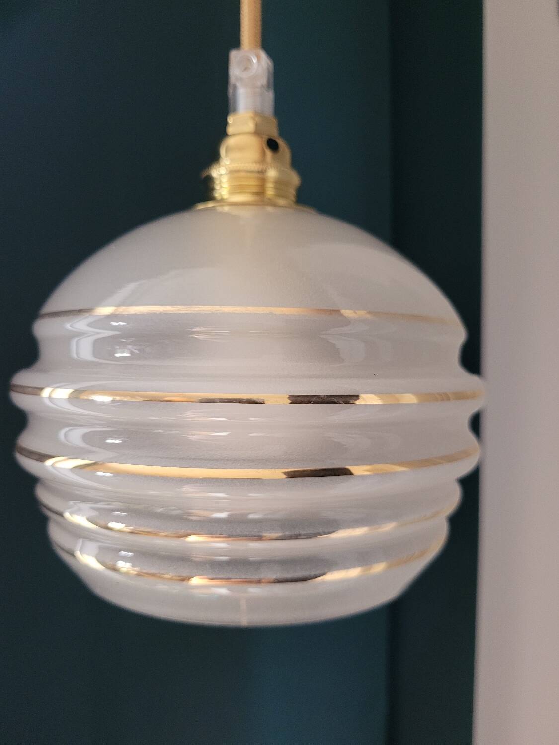 Frosted glass lamp with golden trims