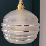 Frosted glass lamp with golden trims