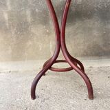 Pedestal table in curved wood