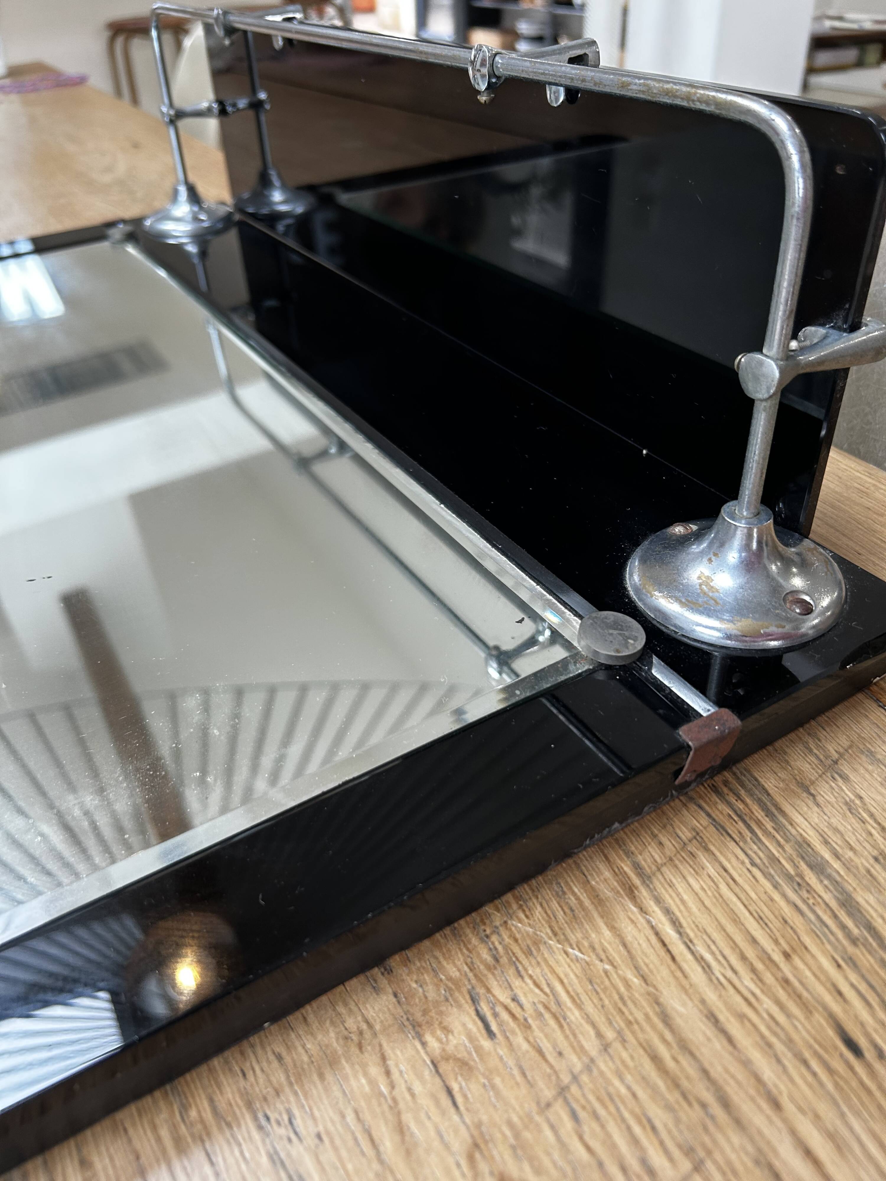Vintage black mirror from the 1930s/40s with shelf.
