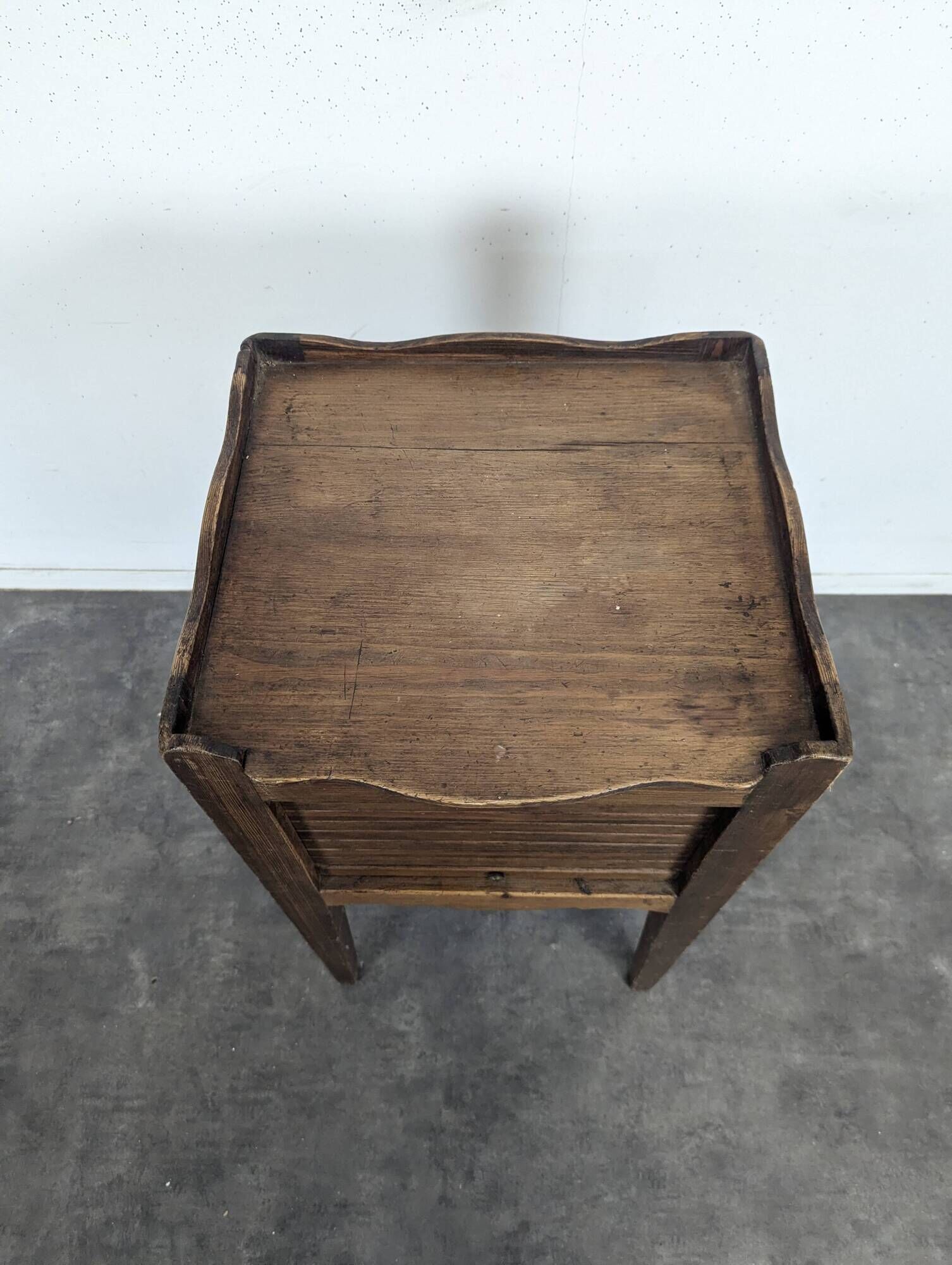 Louis XVI walnut bedside table with pierced hearts curtain