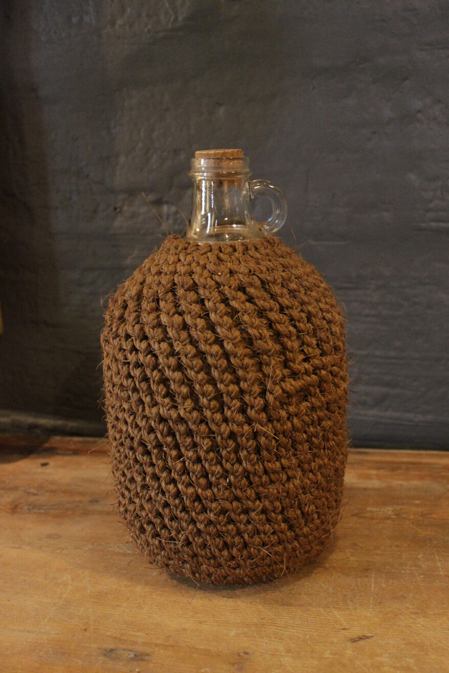 Cylinder glass surrounded by rope