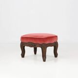 Baroque style foot stool in carved wood with coral velvet upholstery