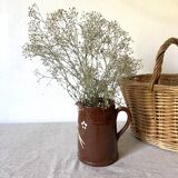 Terracotta pitcher with hand-painted bird decor