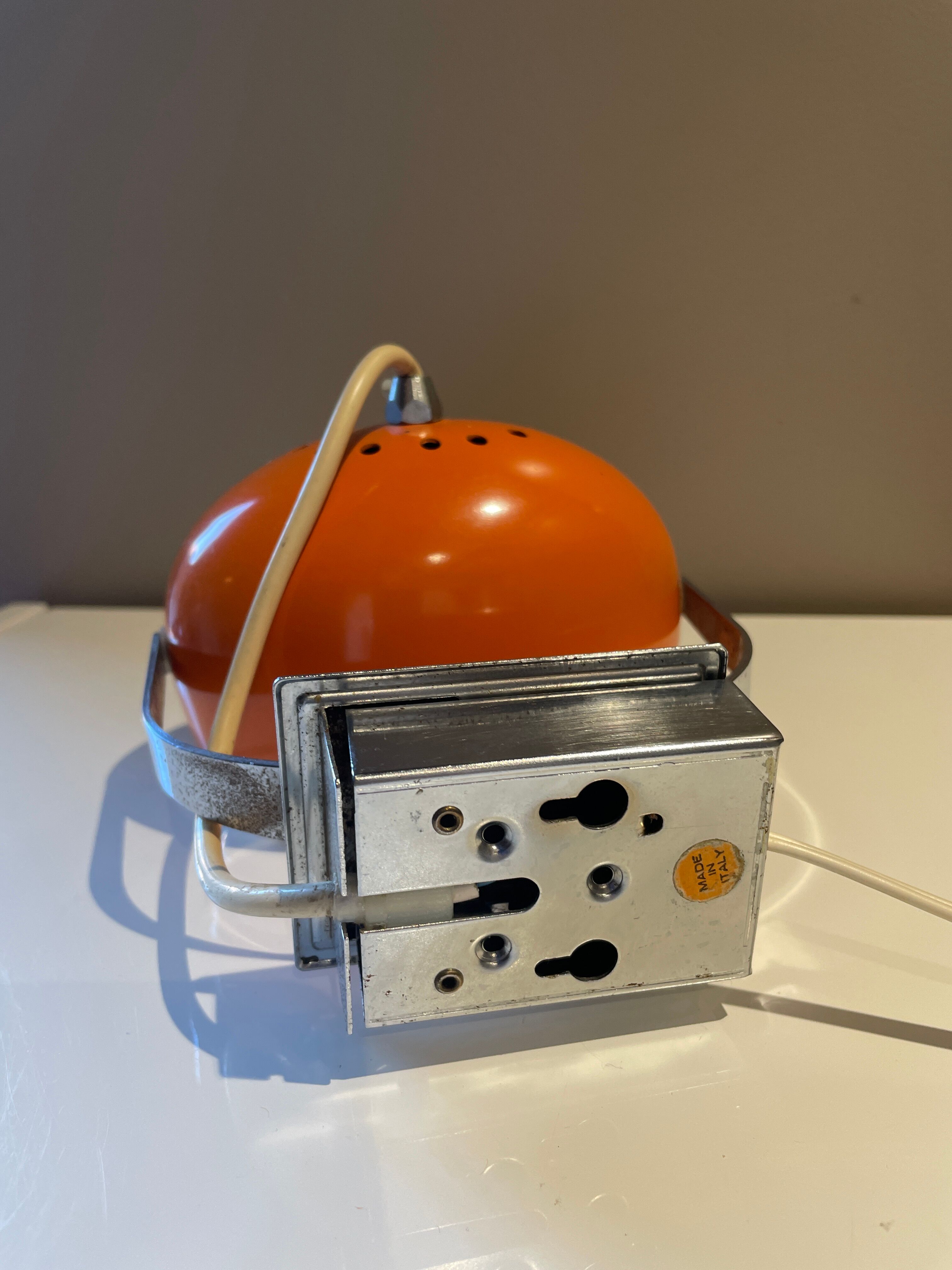 Orange eye ball wall lamp