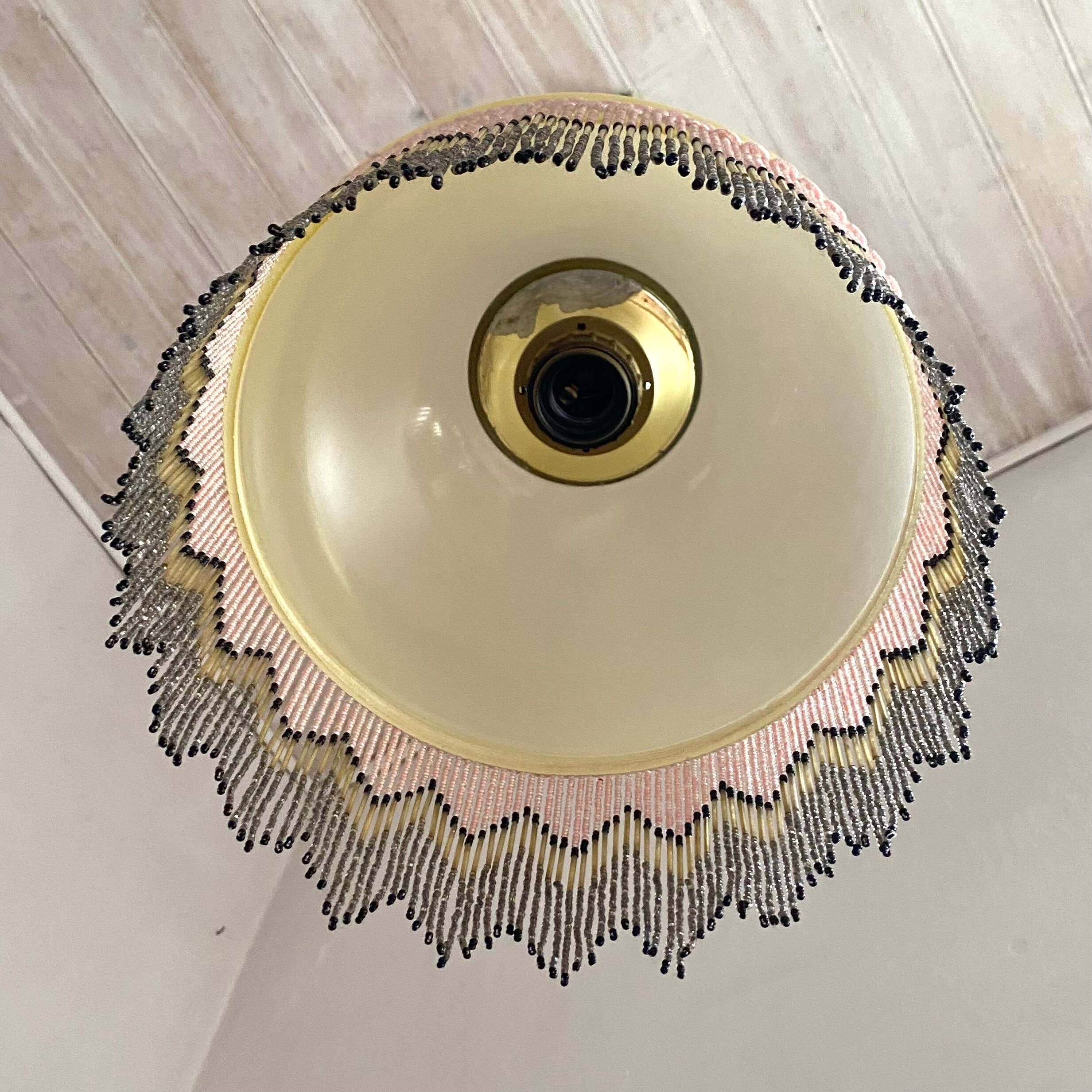 Pendant light in frosted glass and beads