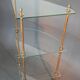 Neoclassical style 3-shelf corner cupboard in gilded brass, Circa 1950/1960.