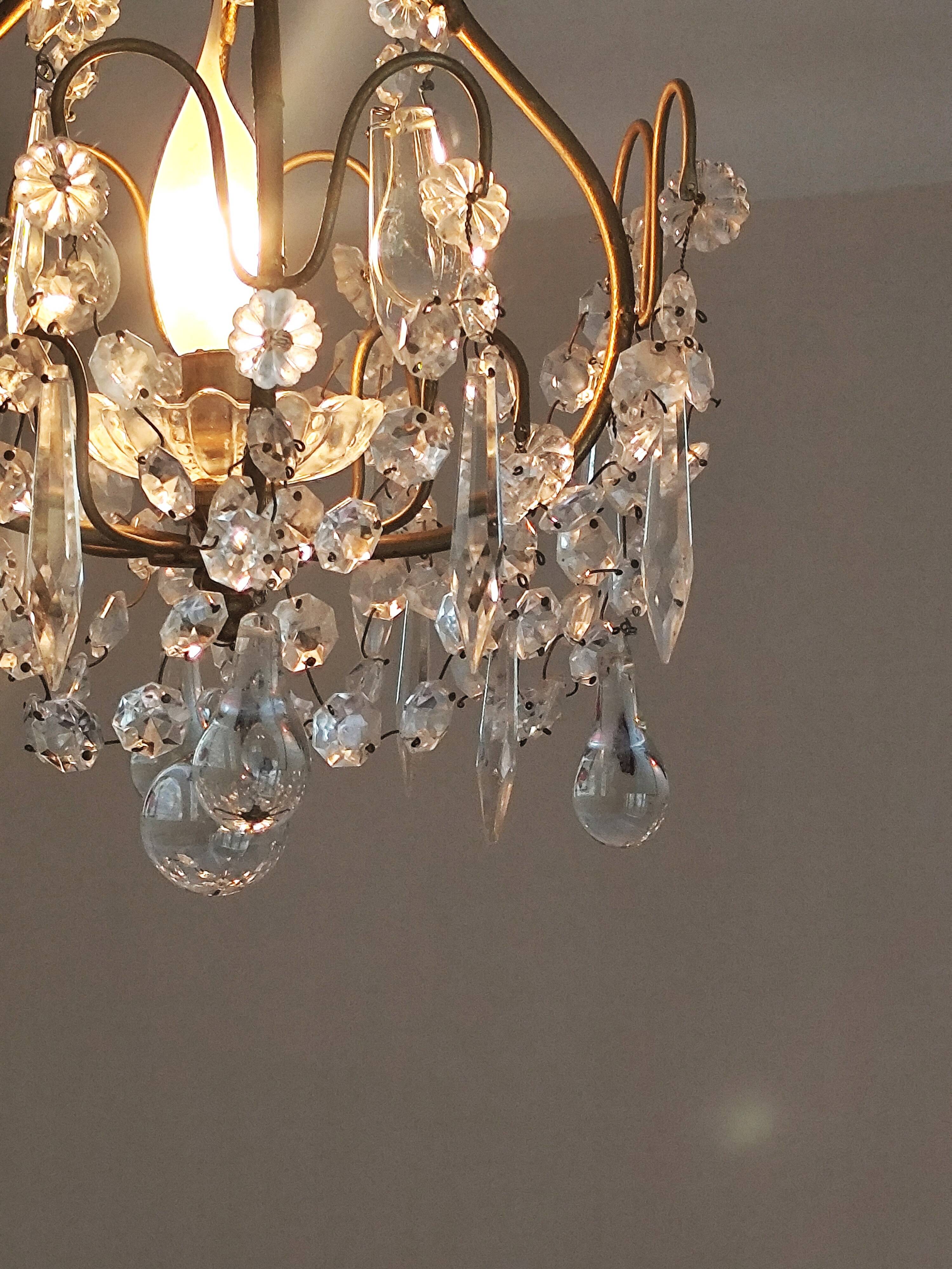 brass cage chandelier with crystal tassels
