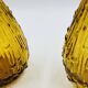 Set of two vintage textured amber glass Empoli bottles.