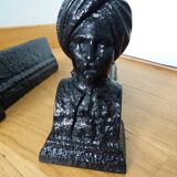 Cast iron andirons with character heads