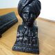 Cast iron andirons with character heads
