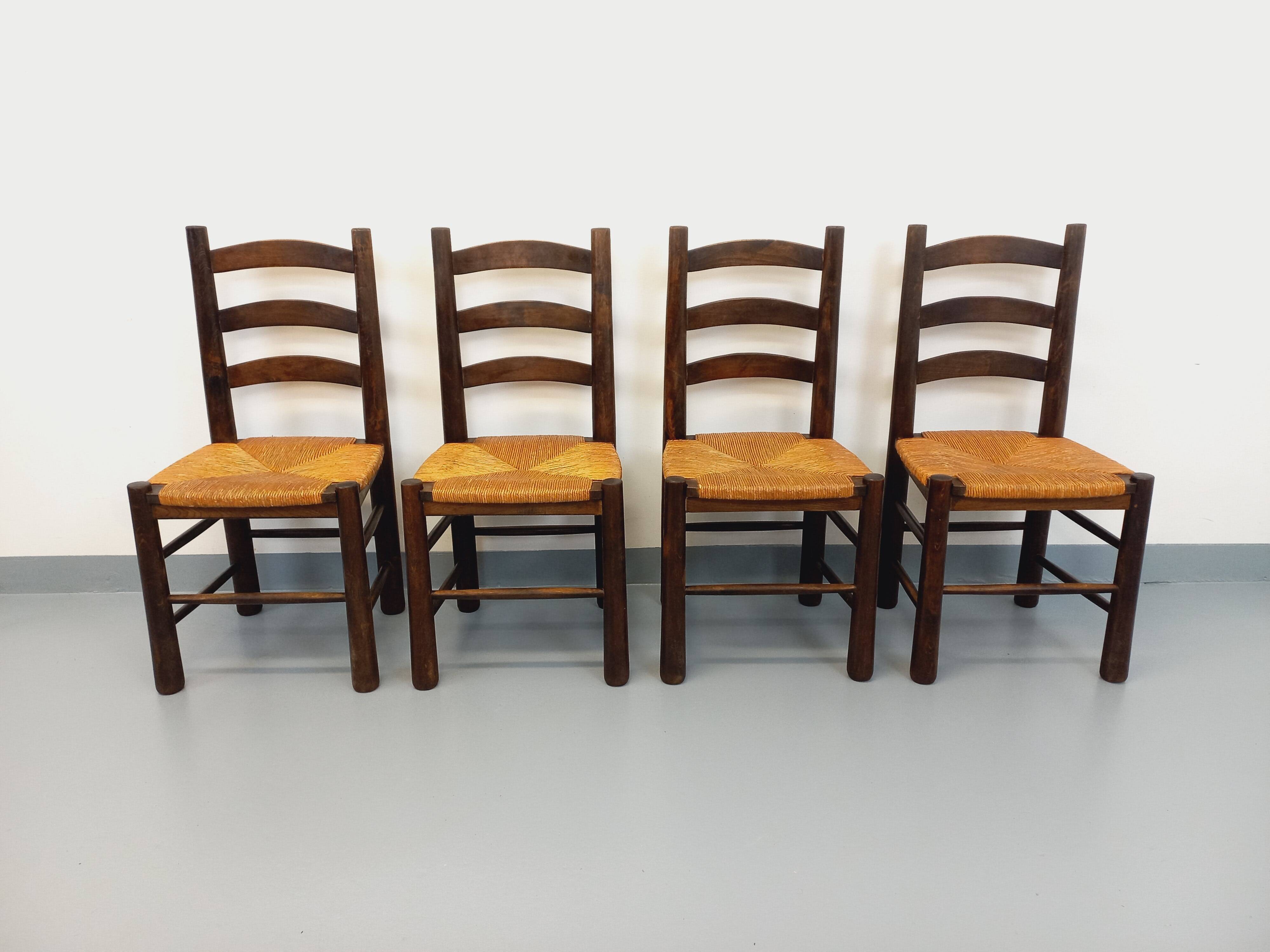 Set of 4 vintage brutalist chairs by Georges Robert in wood and straw.